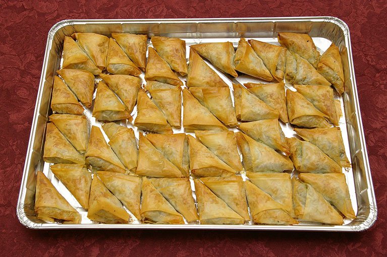 Greek spinach pie party tray — spanakopita with feta in phyllo dough